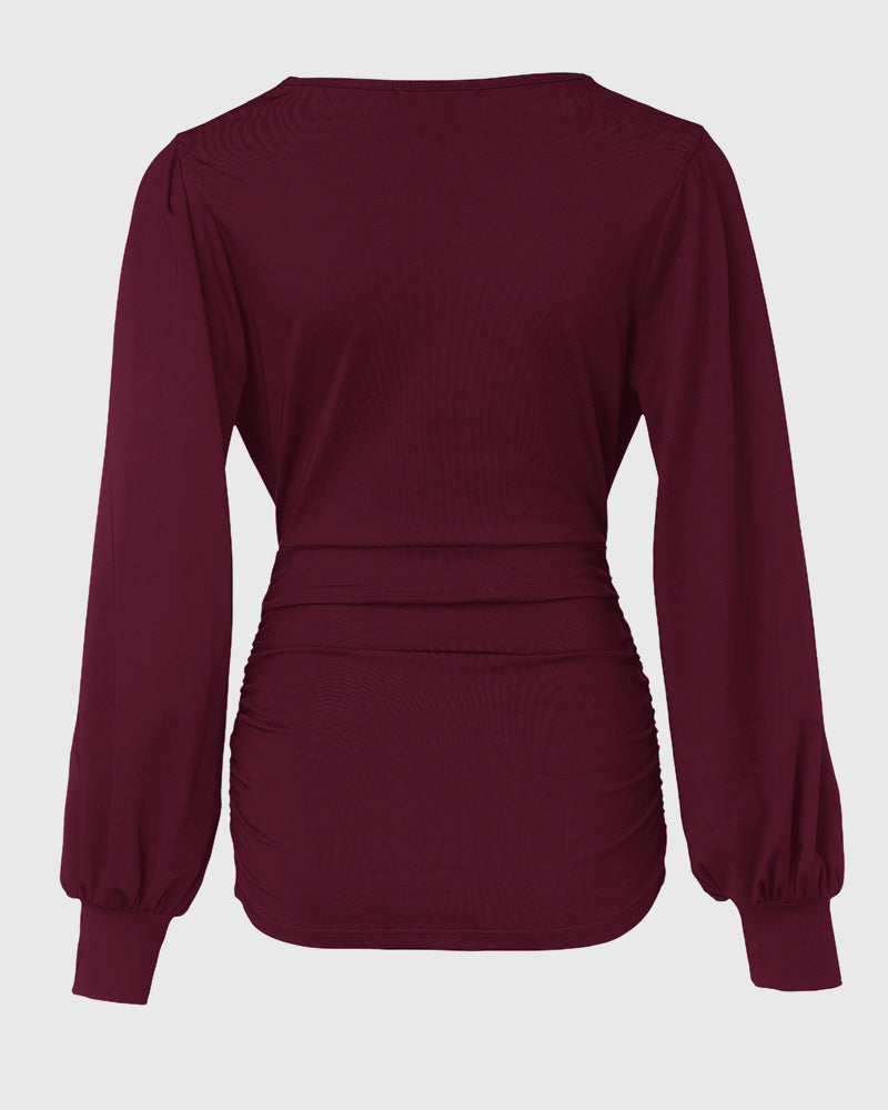 Blusa Elegante con Scollo Profondo, Maniche a Lanterna e Arricciature Laterali