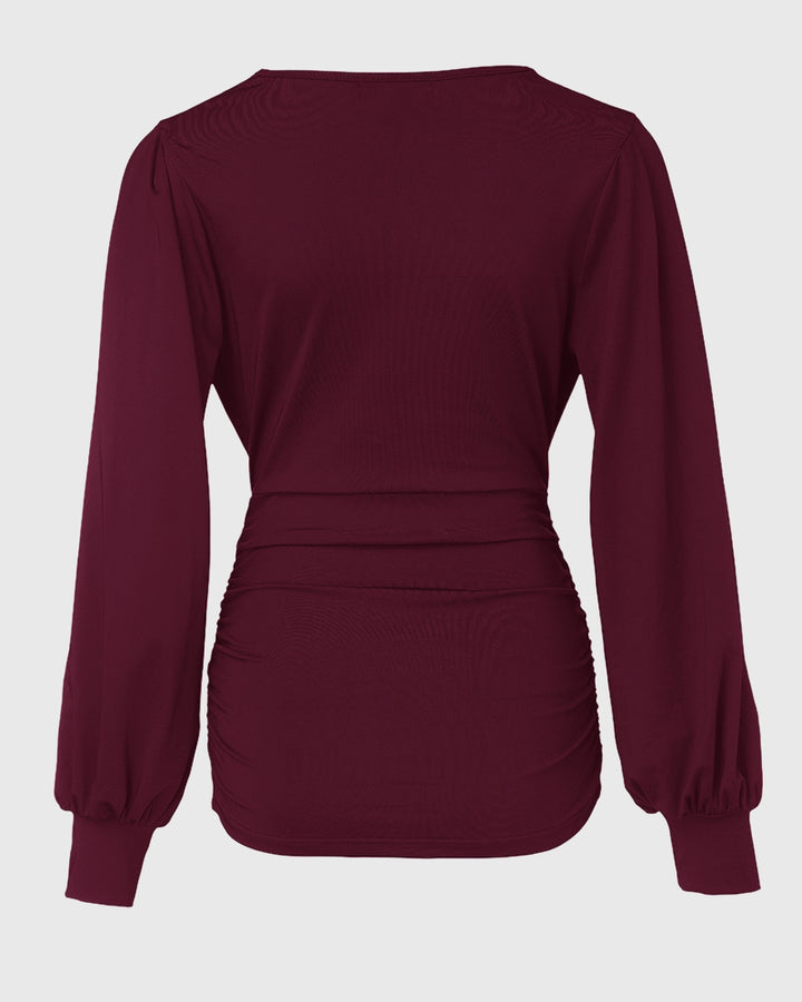 Blusa Elegante con Scollo Profondo, Maniche a Lanterna e Arricciature Laterali