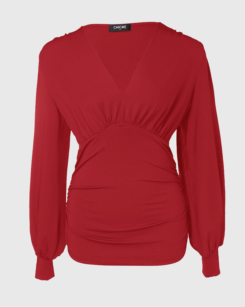 Blusa Elegante con Scollo Profondo, Maniche a Lanterna e Arricciature Laterali