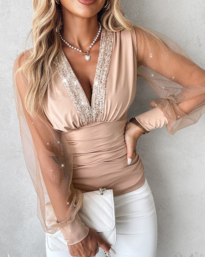 Blusa Elegante con Scollo Profondo, Maniche a Lanterna e Arricciature Laterali