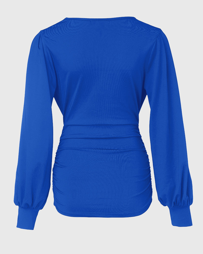 Blusa Elegante con Scollo Profondo, Maniche a Lanterna e Arricciature Laterali