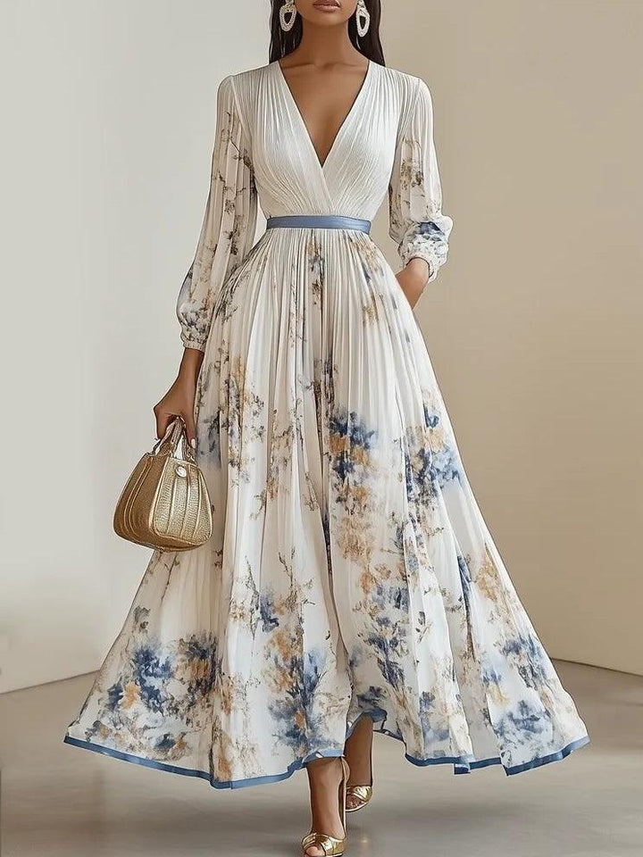 Abito lungo plissettato con stampa floreale e maniche a palloncino – Eleganza romantica per ogni occasione