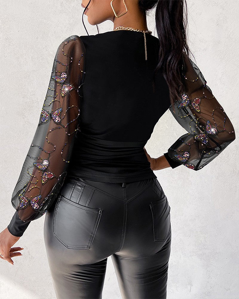 Blusa Elegante con Scollo Profondo, Maniche a Lanterna e Arricciature Laterali