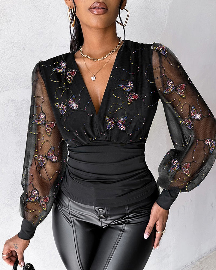 Blusa Elegante con Scollo Profondo, Maniche a Lanterna e Arricciature Laterali