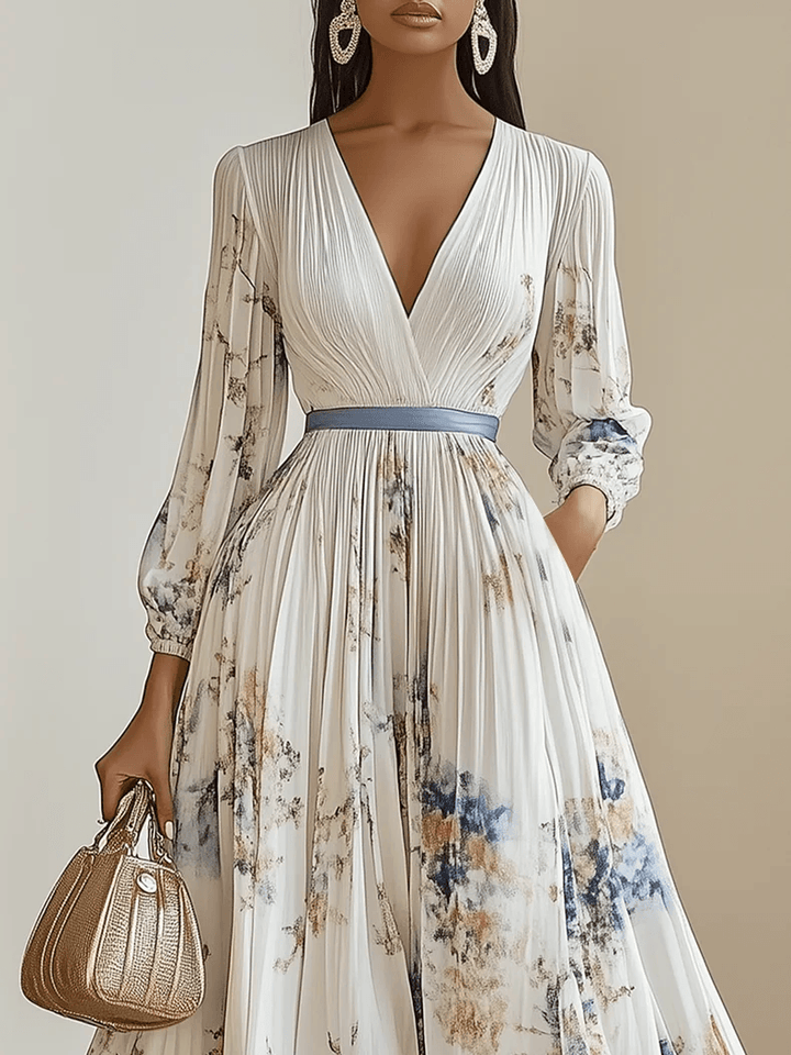 Abito lungo plissettato con stampa floreale e maniche a palloncino – Eleganza romantica per ogni occasione